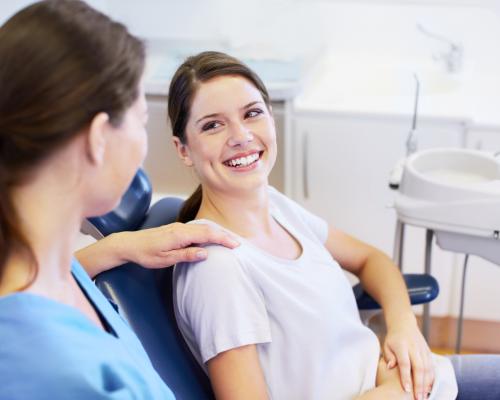 Dentist reassuring patient